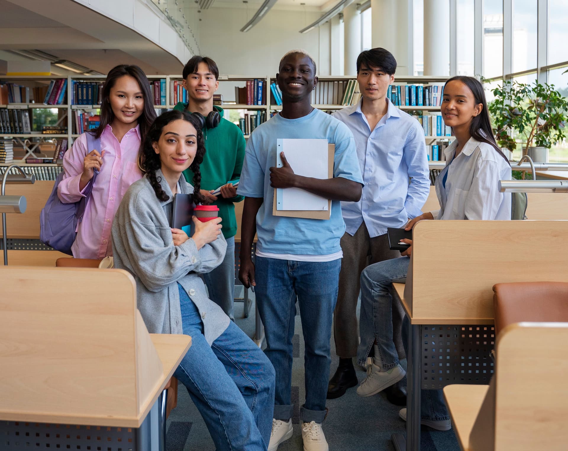 full-shot-smiley-students-library